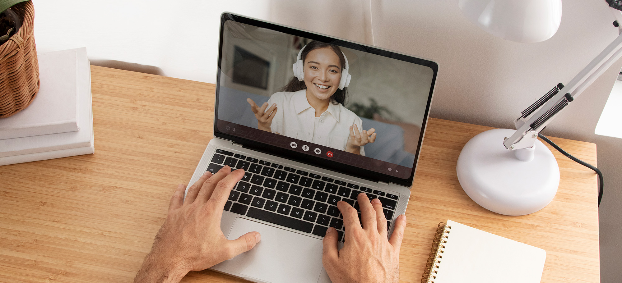 A woman is on a computer screen in a zoom call with an offscreen man.